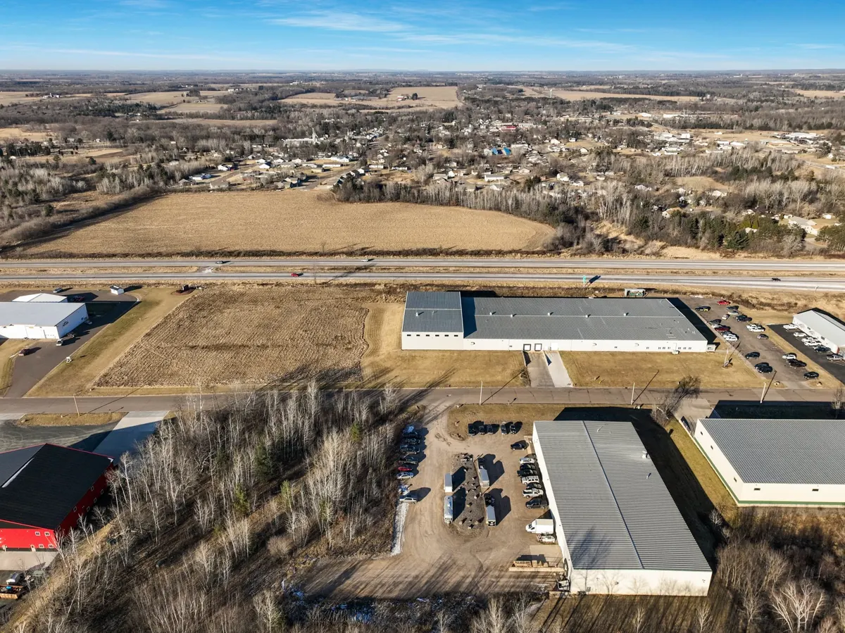 Aerial view of industrial buildings near a highway