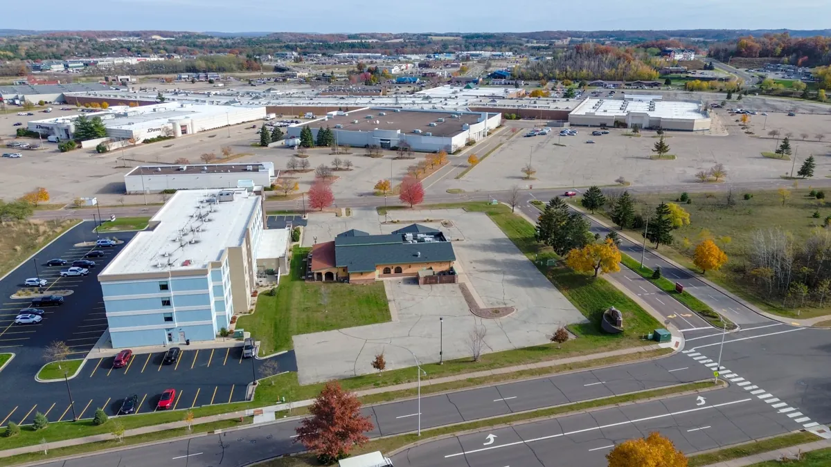 Aerial view of a retail corridor with parking