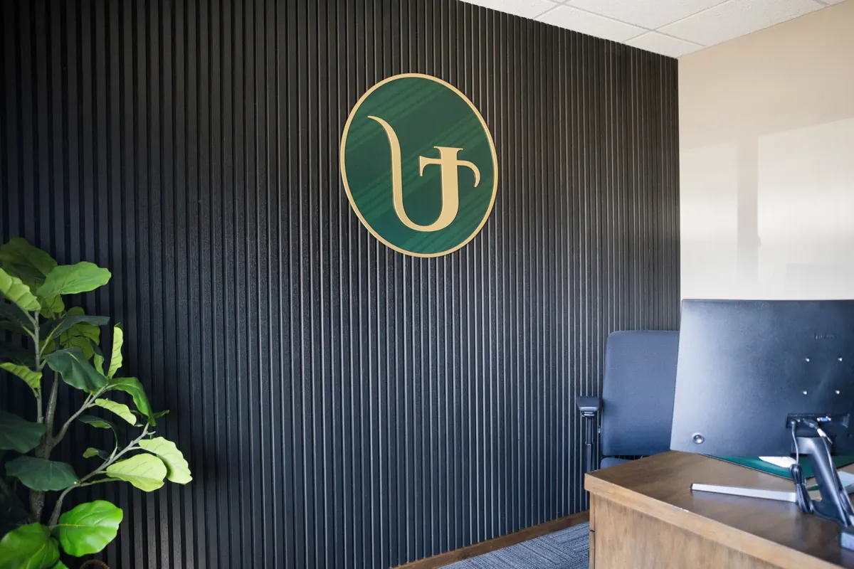 Ultra Commercial Realty office lobby with the gold Ultra logo